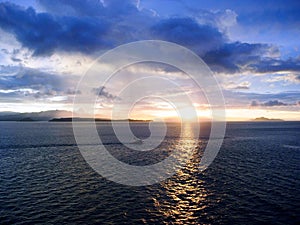 Blue Clouds Reflect Sunrise in the Sea inside Panama Canal