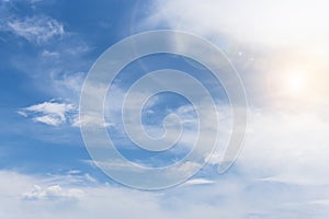 Blue cloudy sky, sky background with sun flare, place for text