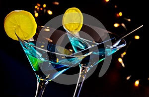 Blue cocktail drink on a disco bar table, club atmosphere