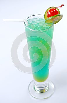 Blue cocktail drink with lemon slices