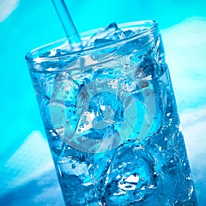 Blue cocktail in the glass with ice