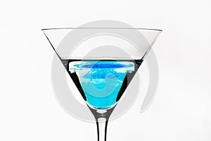 Blue cocktail isolated on white. One blue cocktail martini isolated.