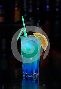 Blue cocktail with a lemon