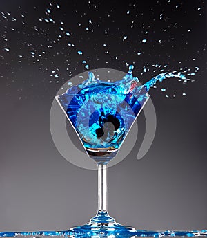 Blue cocktail splashing