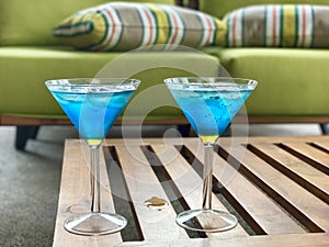 Blue cocktails on coffee table