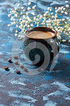 Blue coffee cup on dark blue background