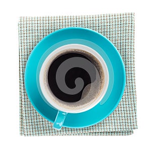 Blue coffee cup over kitchen towel