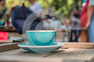 Blue coffee cup on wooden table,Close-up photo of blue coffee cu