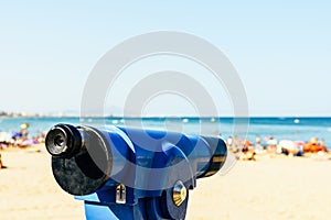 Blue Coin Operated Telescope With Beach And Ocean