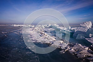 Blue and cold ice of Lake Baikal. Hummocks