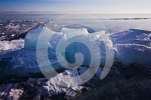 Blue and cold ice of Lake Baikal. Hummocks and heaps of ice