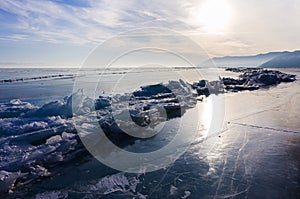 Blue and cold ice of Lake Baikal. Hummocks and heaps of ice