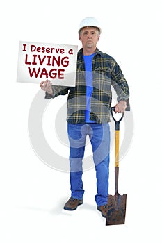 Blue collar construction worker man in hard hat with a shovel holding a sign saying I Deserve a LIVING WAGE