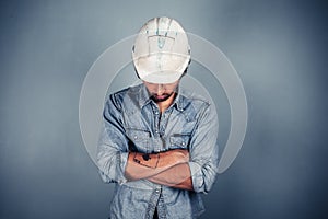 Blue collar worker with arms crossed