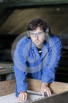 Blue collar worker in factory