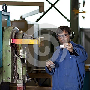 Blue collar worker in factory