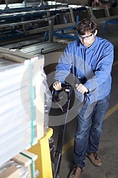 Blue collar worker with pallet