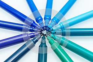 Blue color. Close up of blue colored felt-tip pens on isolated background. Selective focus