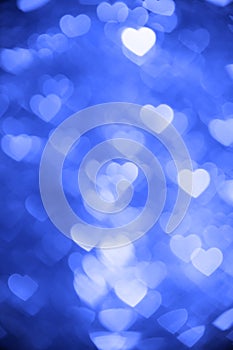 Blue color heart bokeh background photo. Abstract holiday, celebration backdrop.