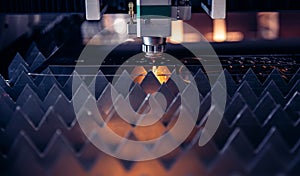 Blue color Laser CNC cut of metal with light spark, technology modern industrial banner