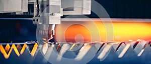 Blue color Laser CNC cut of metal with light spark, technology modern industrial banner
