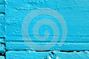 Blue color old painted wooden wall lit by sun close-up. Abstract background