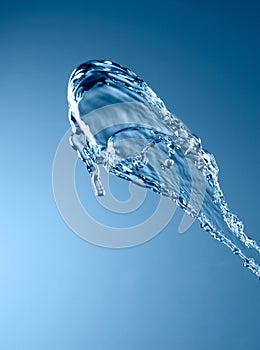 Blue color water splash isolated on empty background, studio photo