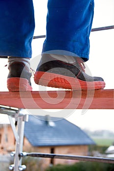 Blue color worker on a scaffolding