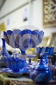 A blue colored Arabic vase is on display at a shop in Muscat Festival