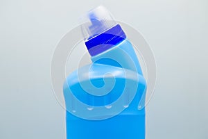 Blue colored plastic detergent bottle. Cosmetic, container. Bottles, dirty.