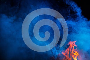 Blue colored smoke wuth fireflames photo