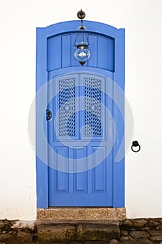 Blue colorful front house door in parati brazil photo