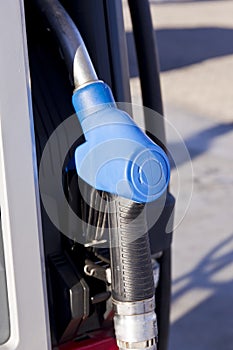 Blue coloured handle of a petroleum pump