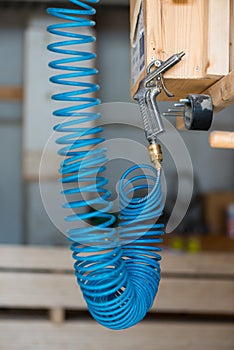 Blue compressed pneumatic air hose with pistol