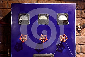 Blue control panel with valves