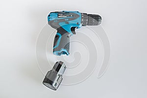 A blue cordless drill with battery pack for worker