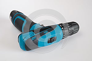 A blue cordless drill with battery pack for worker