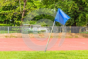 Blue corner flag on an soccer field