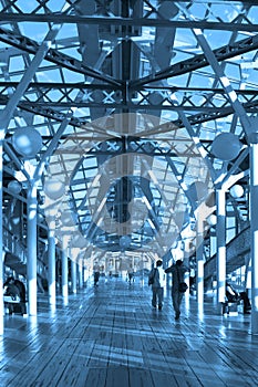 Blue corridor, spheres and people