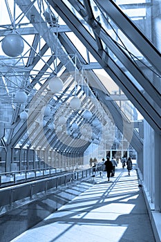 Blue corridor, spheres and people