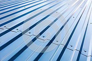 Blue corrugated metal roof with rivets