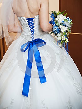 Blue corset bride and the bridal bouquet