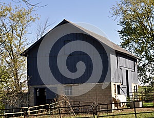 Blue Barn with White horse on the side - in the country.