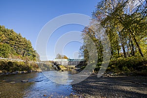 Blue covered wooden bridge in Vermont, countryside