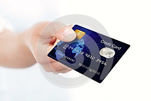 Blue credit card holded by hand