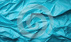 Blue crumpled paper background. Close up of crumpled blue paper