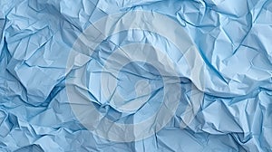 Blue crumpled paper texture background. Light colored old creased and wrinkled paper abstract background. Grunge texture