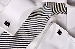 Blue cuff links on white shirt