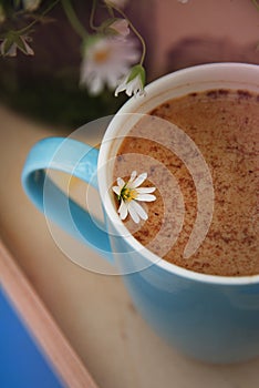 Blue Cup of Coffee Milk Latte Drink Cinnamon Sticks Wooden Background Rustic Camomile Flower Buquet Flat Lay