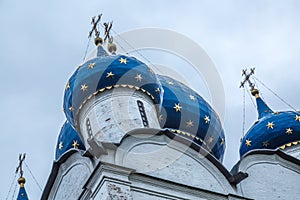 Blue cupola golden stars orthodox church closeup